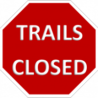 red hexagon with the words trails closed