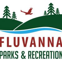 evergreen trees on green mountains with a red bird flying above