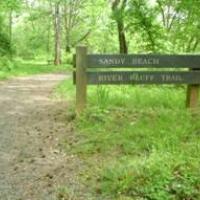 Sandy beach trail head sign