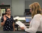 photo of C Solis swearing in as clerk to the board