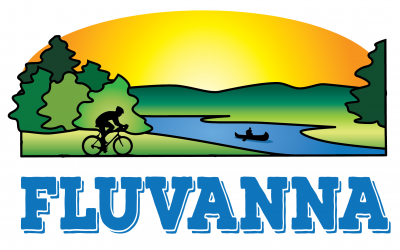 a person rides a bike in front of a river. a yellow sunset is in the distance. Green trees are on either side of the river.