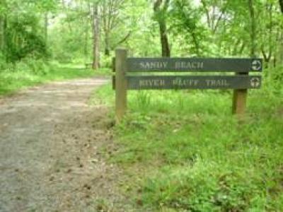 Sandy beach trail head sign